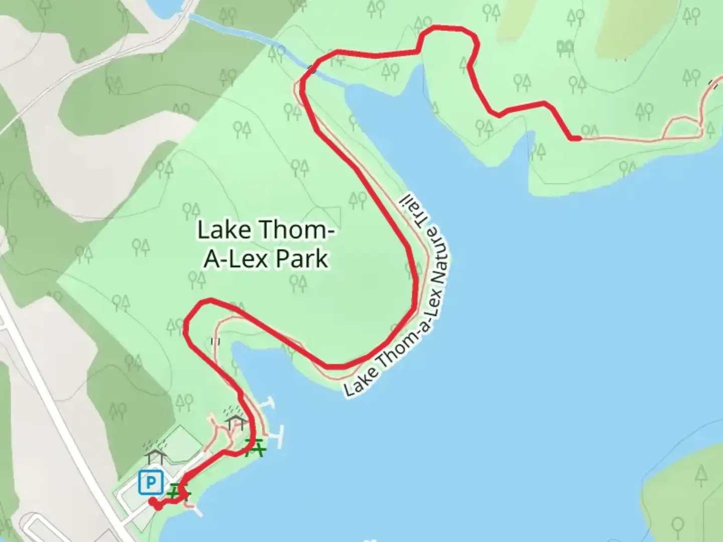 An image depicting the trail Lake Thom-A-Lex Park Walk and its surrounding area.