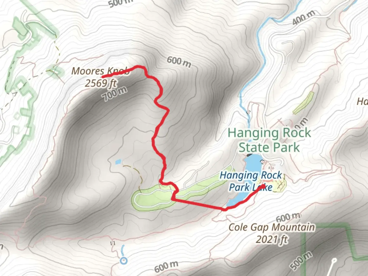 An image depicting the trail Moores Knob from Hanging Rock Park Lake and its surrounding area.