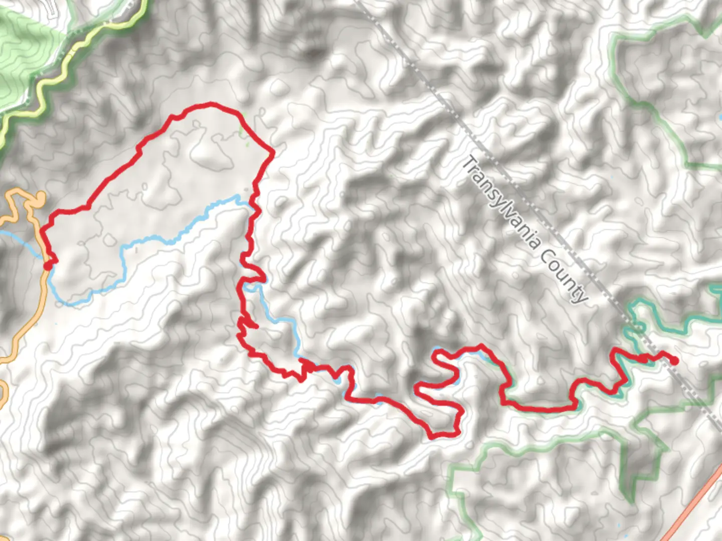 An image depicting the trail Yellow Gap Road to South Mills River Road and its surrounding area.