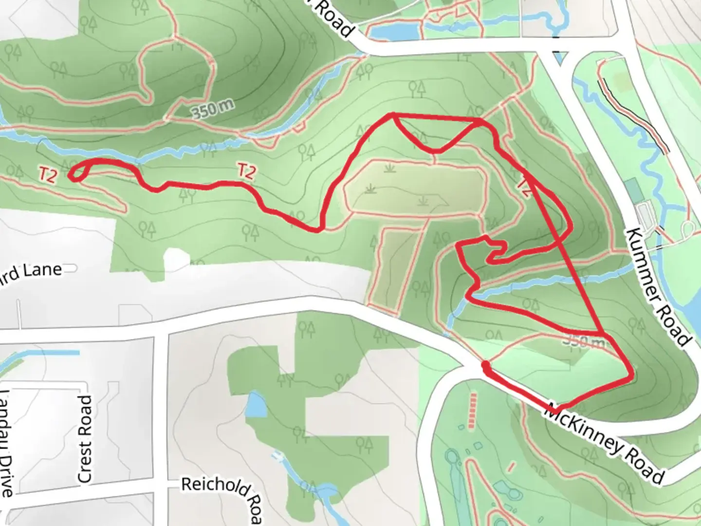 An image depicting the trail Rachel Carson Trail from McKinney Road and its surrounding area.