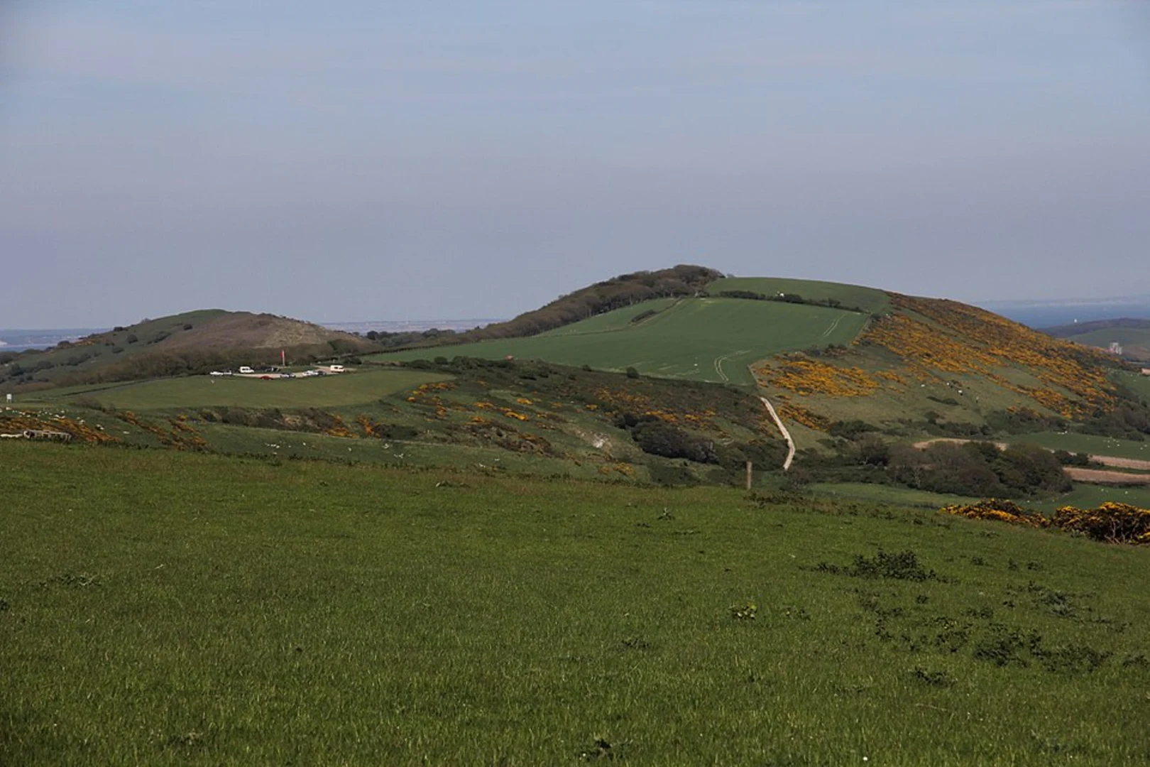 An image depicting the trail Corfe Castle, Kimmeridge and Kingston Loop via Clavell Tower and its surrounding area.
