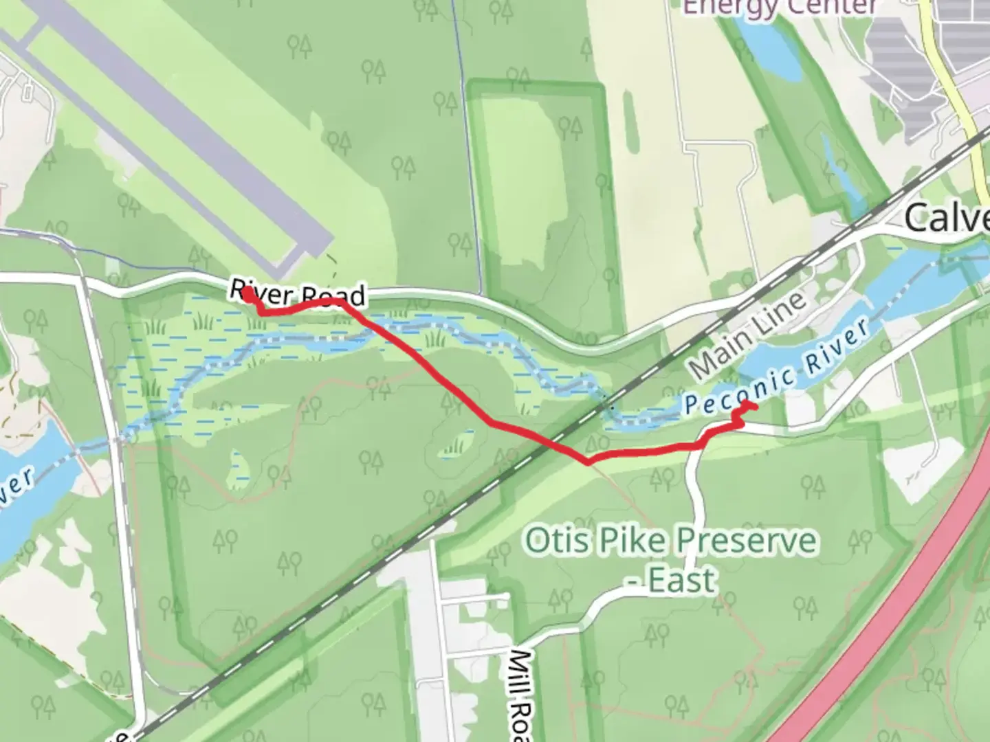 An image depicting the trail Peconic River from River Road and its surrounding area.
