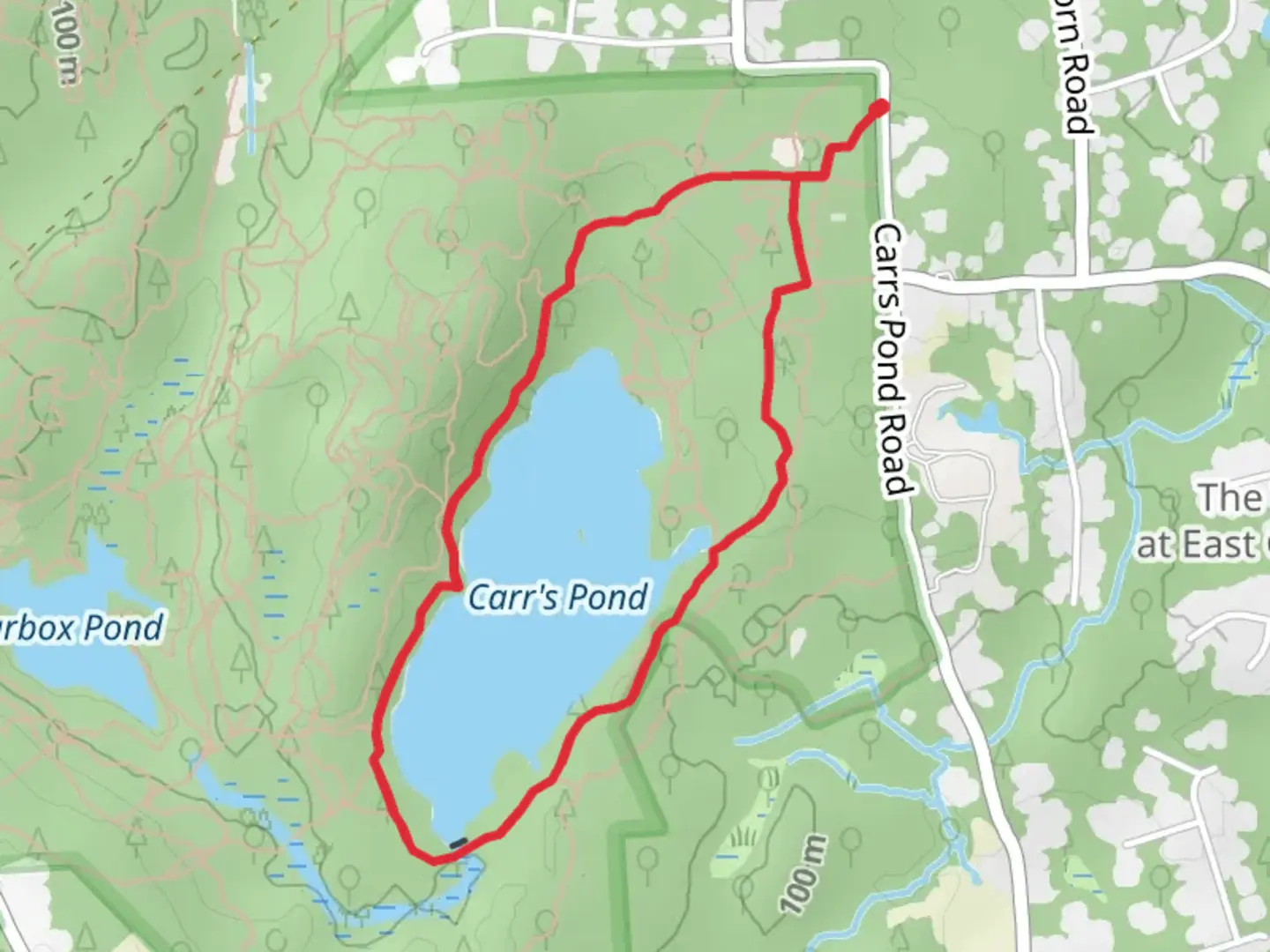 An image depicting the trail Carr's Pond Loop via Ring Road and its surrounding area.