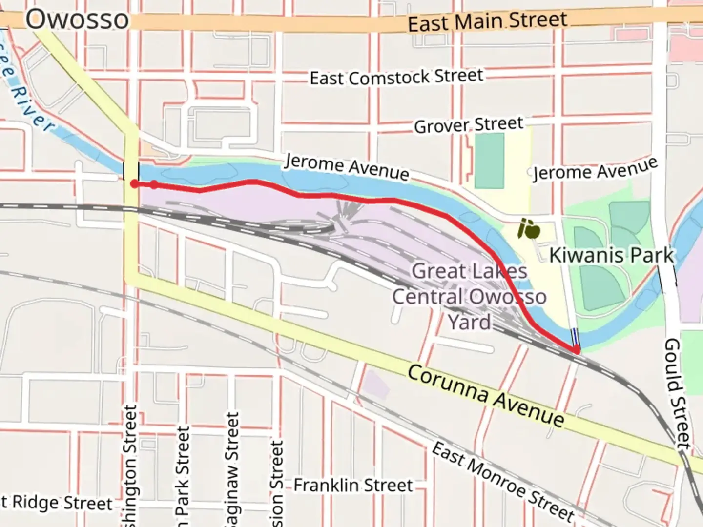 An image depicting the trail Owosso Riverwalk and its surrounding area.