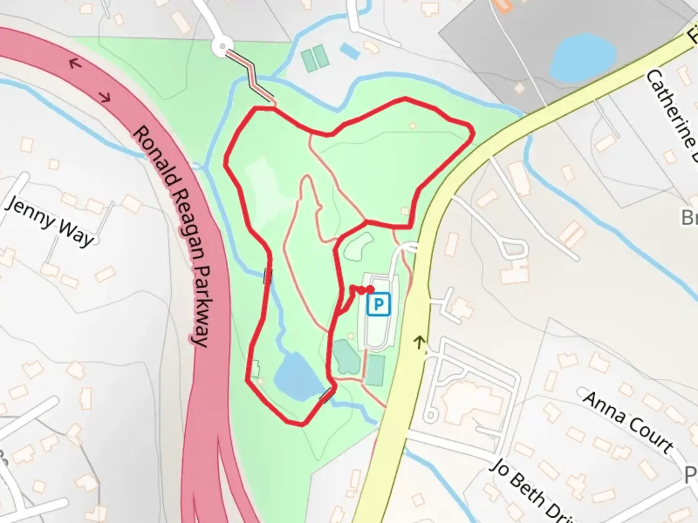 An image depicting the trail Ronald Reagan Park at Five Forks Loop and its surrounding area.