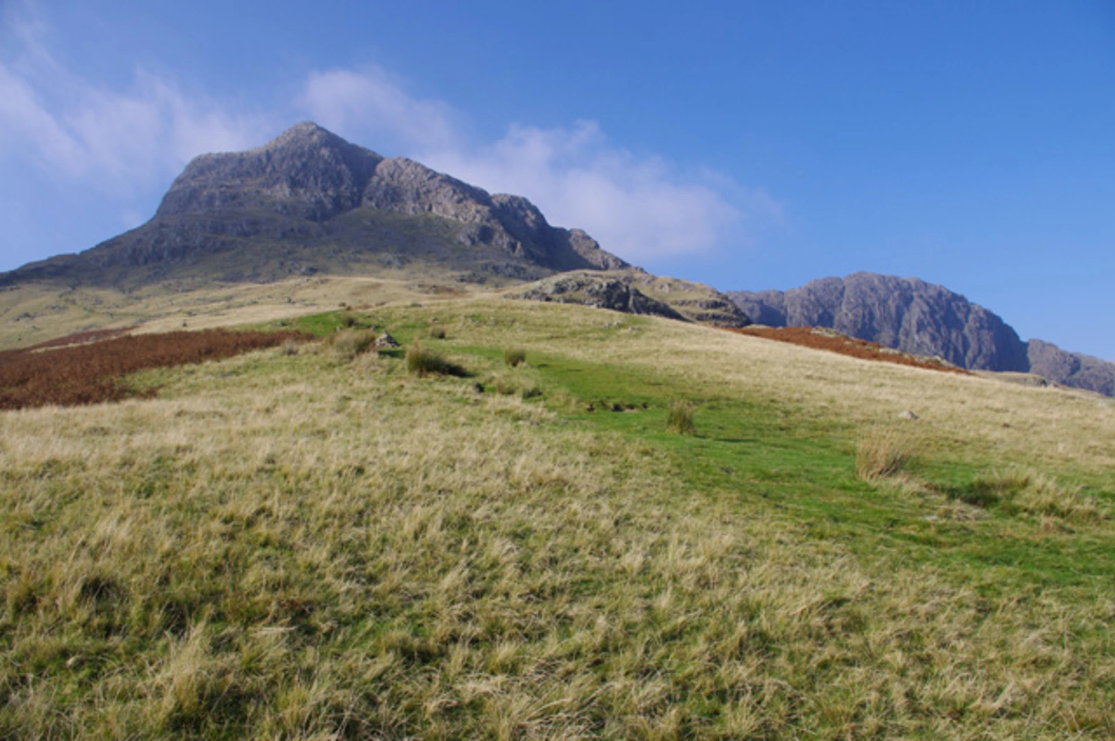 An image depicting the trail Pike of Stickle, Harrison Stickle and Stickle Tarn Loop and its surrounding area.