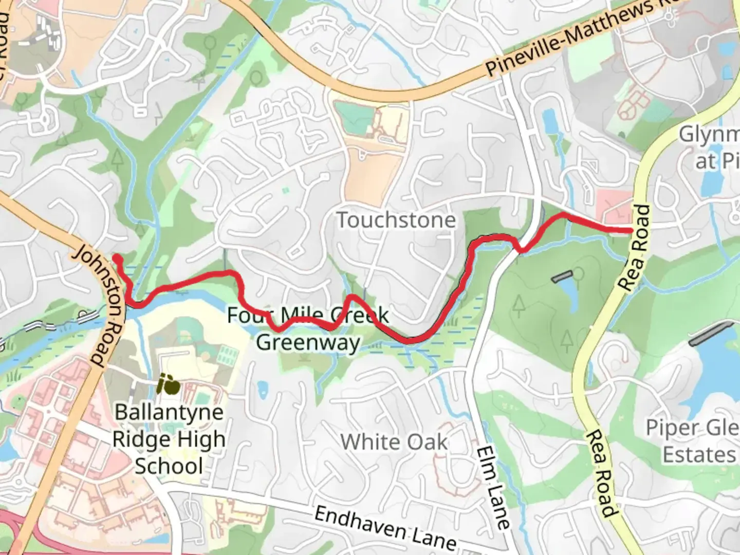 An image depicting the trail Four Mile Creek Greenway from Johnston Road and its surrounding area.