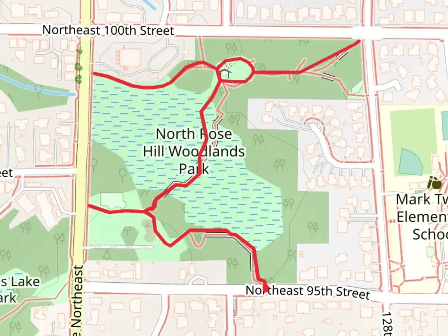 An image depicting the trail North Rose Hill Woodlands Park and its surrounding area.