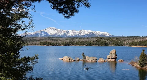 An image depicting the trail Rampart Reservoir Loop via Rainbow Gulch and its surrounding area.
