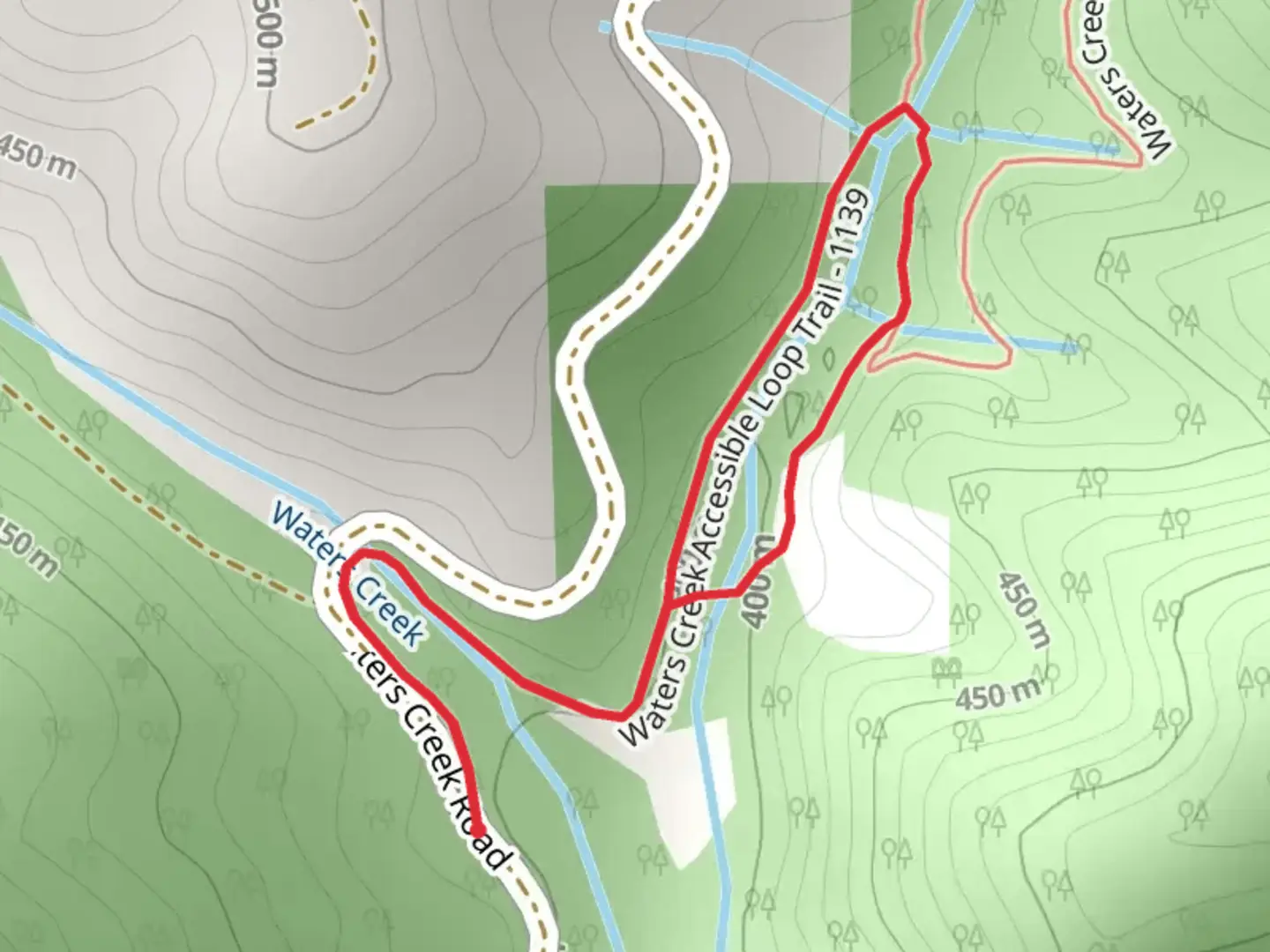 An image depicting the trail Waters Creek Accessible Loop Trail and its surrounding area.