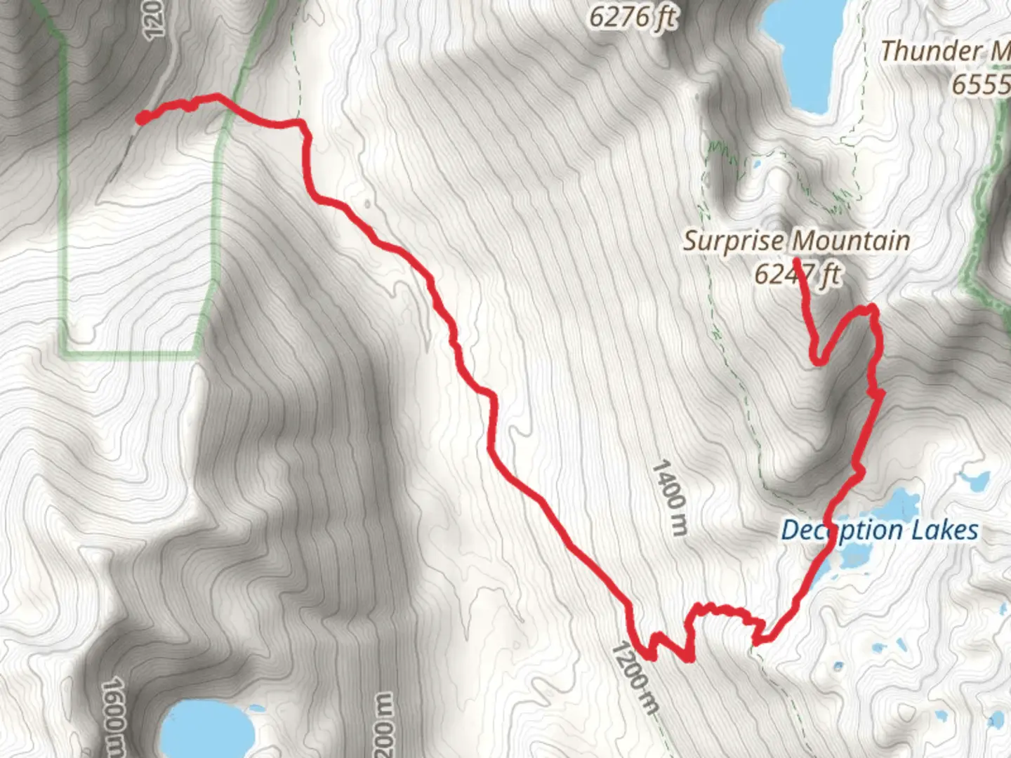 An image depicting the trail Surprise Mountain Trail via Deception Creek Trail and its surrounding area.