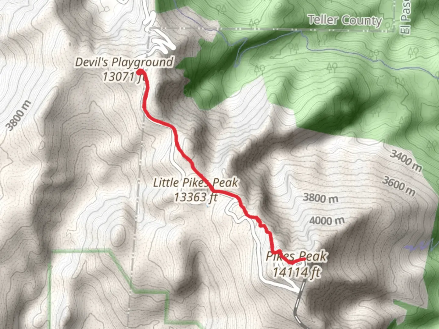 An image depicting the trail Pikes Peak from Devil's Playground and its surrounding area.