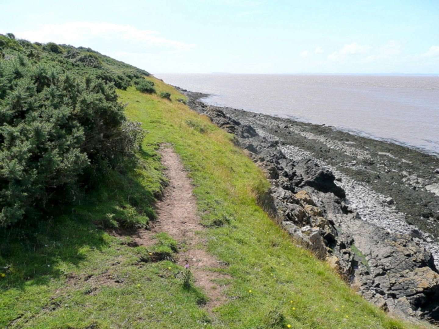 An image depicting the trail National Trust - Sand Point Loop and its surrounding area.