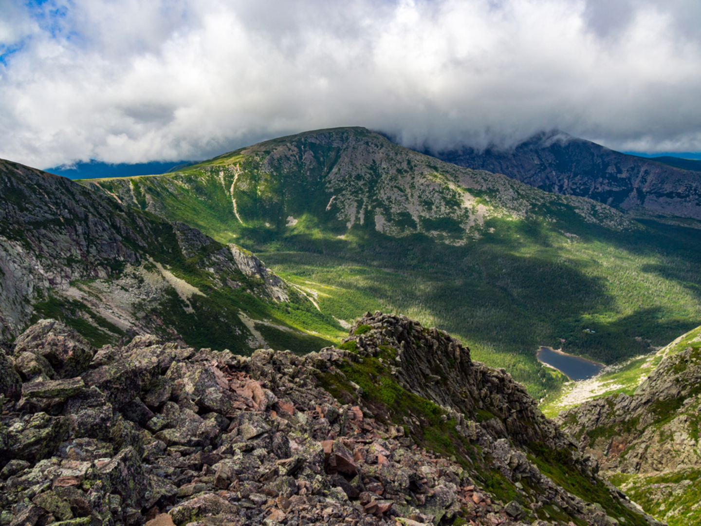 An image depicting the trail Mount Katadin, Pamola and Chimney Pond Loop from Sandy Stream Pond and its surrounding area.