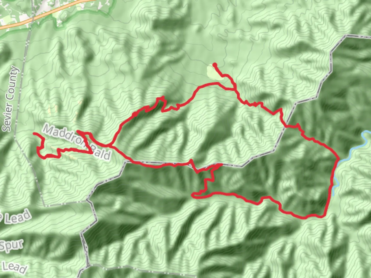 An image depicting the trail Low Gap, Snake Den Mountain, Maddron Bald and Low Gap Loop Trail and its surrounding area.