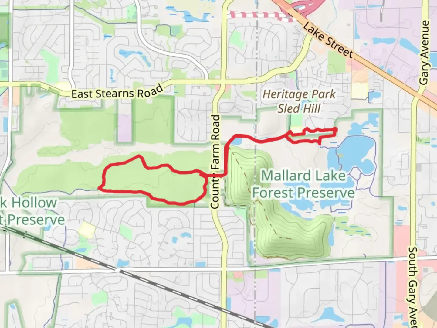 An image depicting the trail North Central DuPage Regional Loop Trail via Cloverdale Pond and its surrounding area.