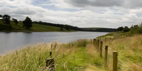 An image depicting the trail Winterburn Reservoir from Winterburn and its surrounding area.