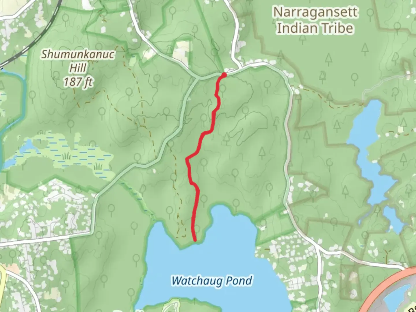 An image depicting the trail Watchaug Pond from Shumankanuc Hill Road and its surrounding area.