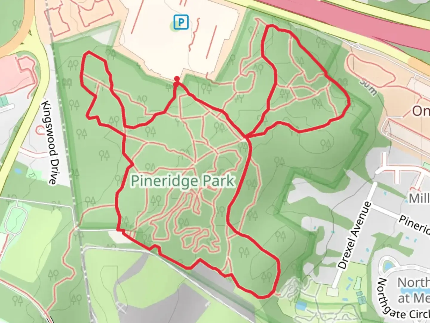An image depicting the trail Kingwood Park East Loop Trail and its surrounding area.