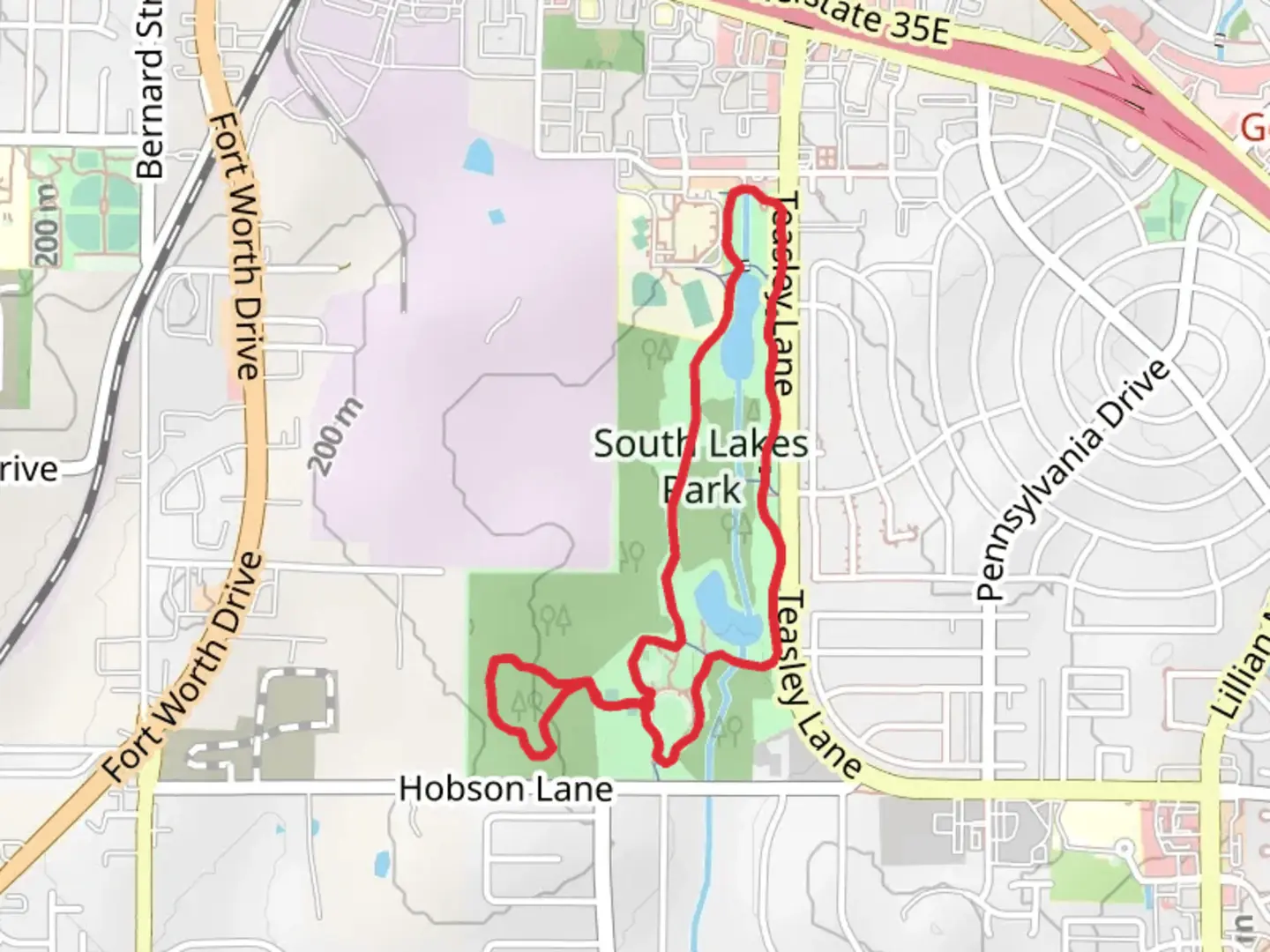 An image depicting the trail South Lakes Park Lake Loop Trail and its surrounding area.