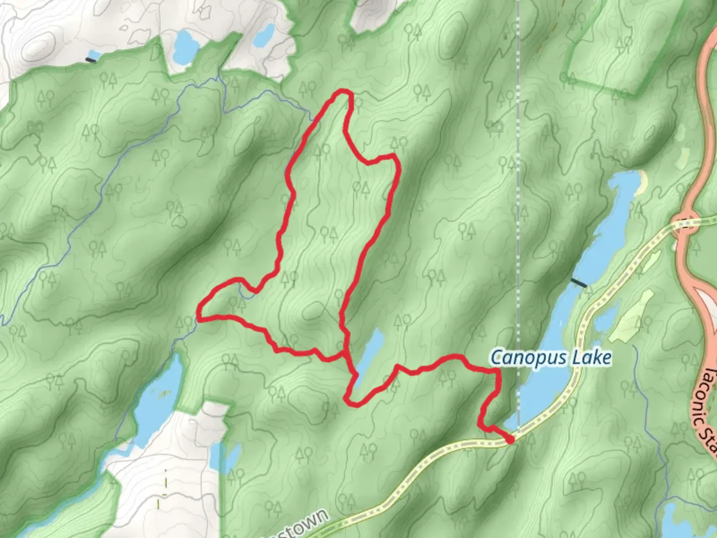 An image depicting the trail Charcoal Burners Trail - Red Loop via Fahnestock Trail and its surrounding area.