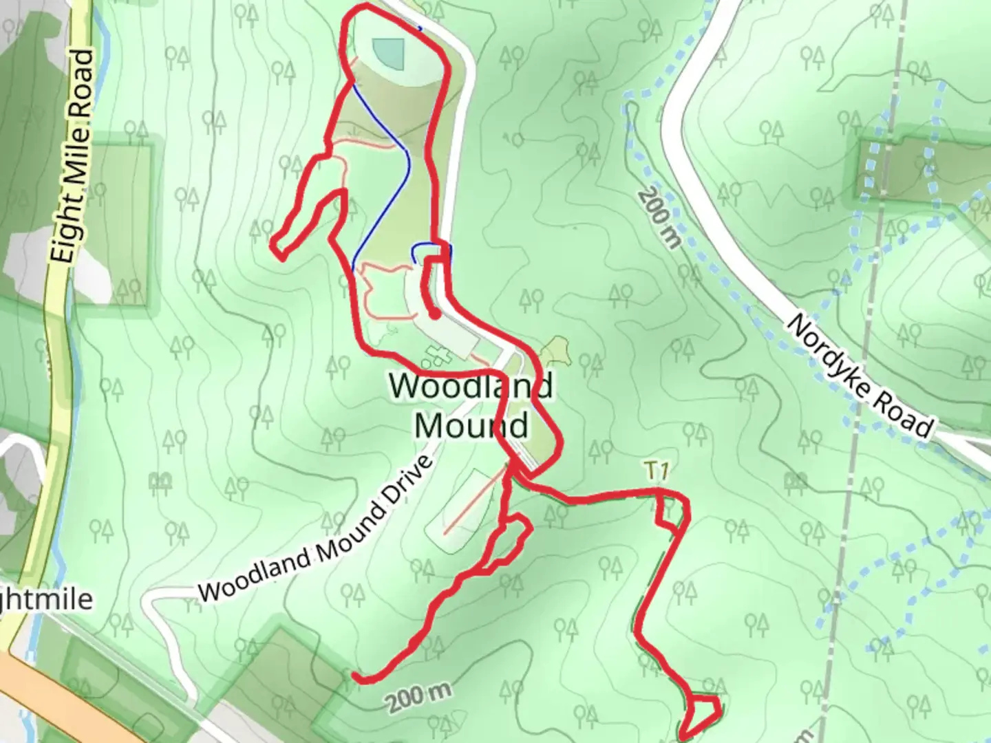 An image depicting the trail Woodland Mound - Parcourse Trail and its surrounding area.
