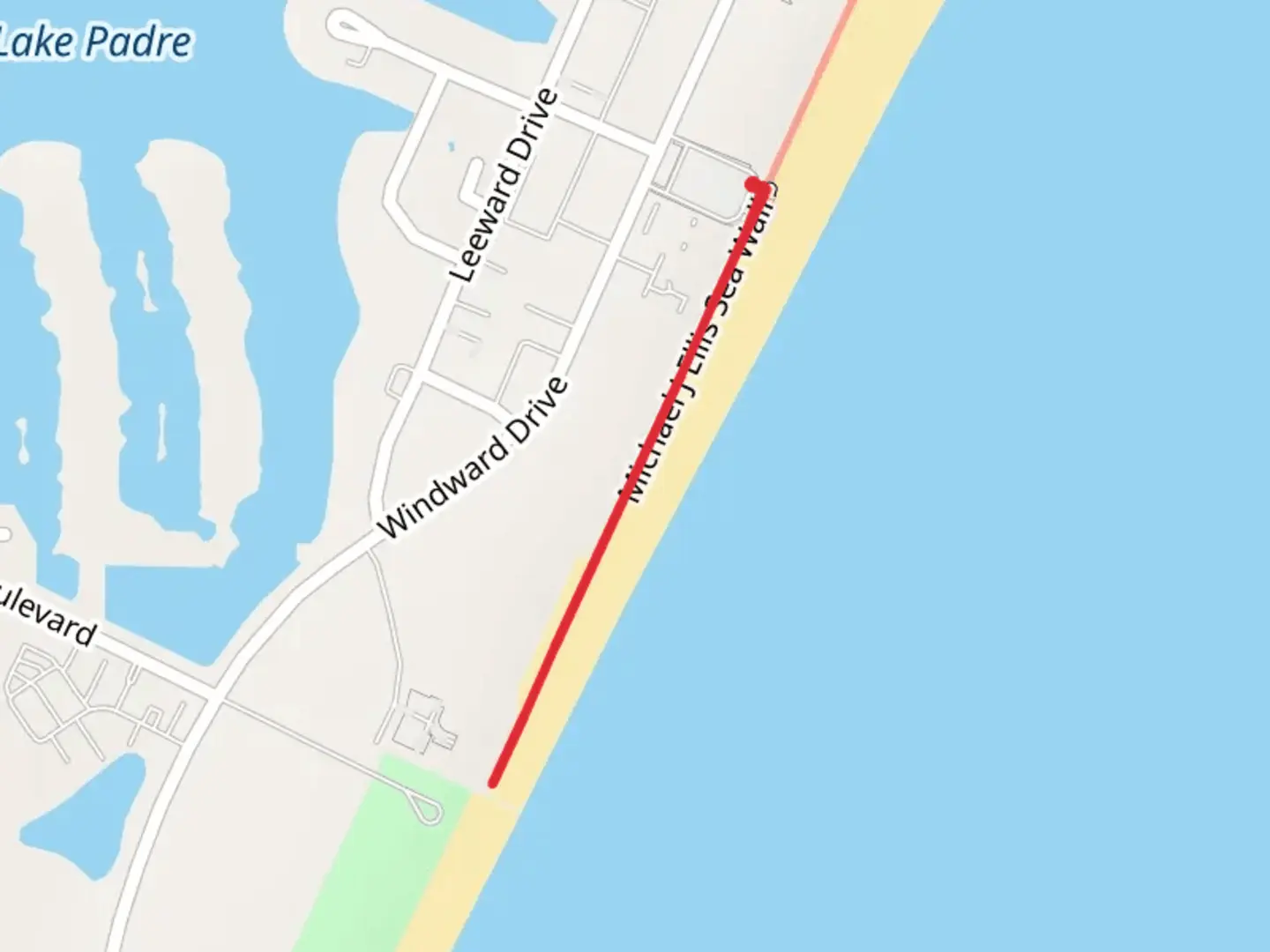 An image depicting the trail Michael J Ellis Sea Wall and its surrounding area.