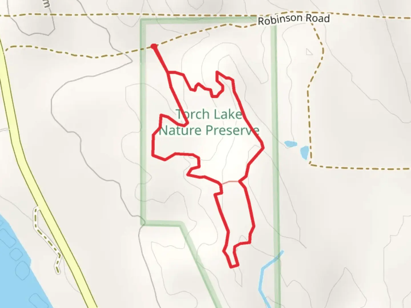 An image depicting the trail Torch Lake NAture Preserve Loop and its surrounding area.