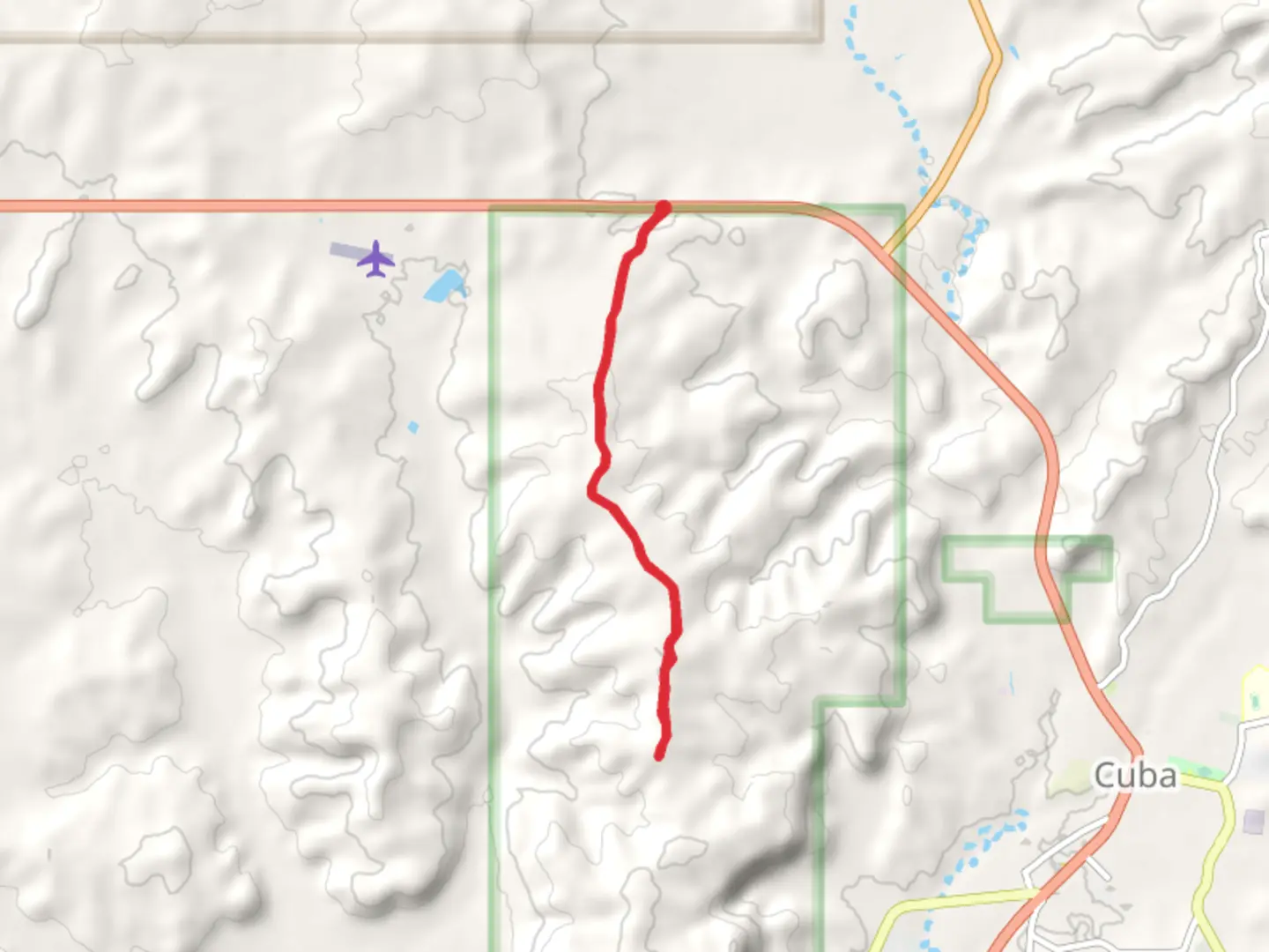 An image depicting the trail Mesa de Cuba from USFS Road 88 and its surrounding area.
