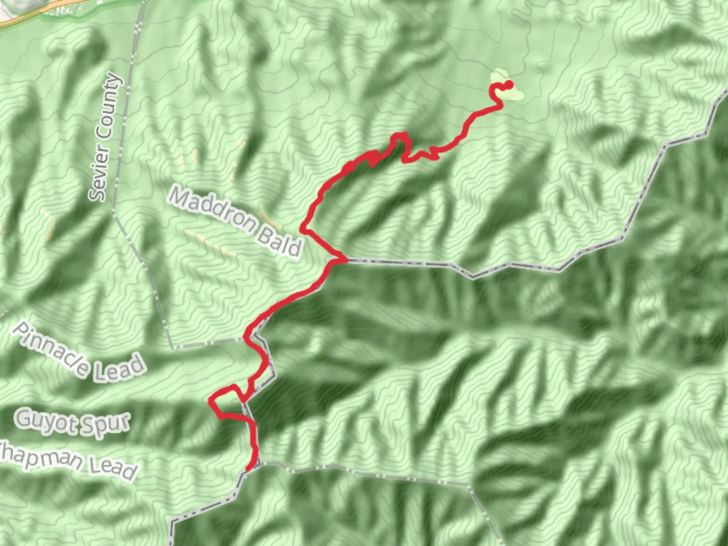 An image depicting the trail Tricorner Knob via Snake Den Ridge Trail and its surrounding area.