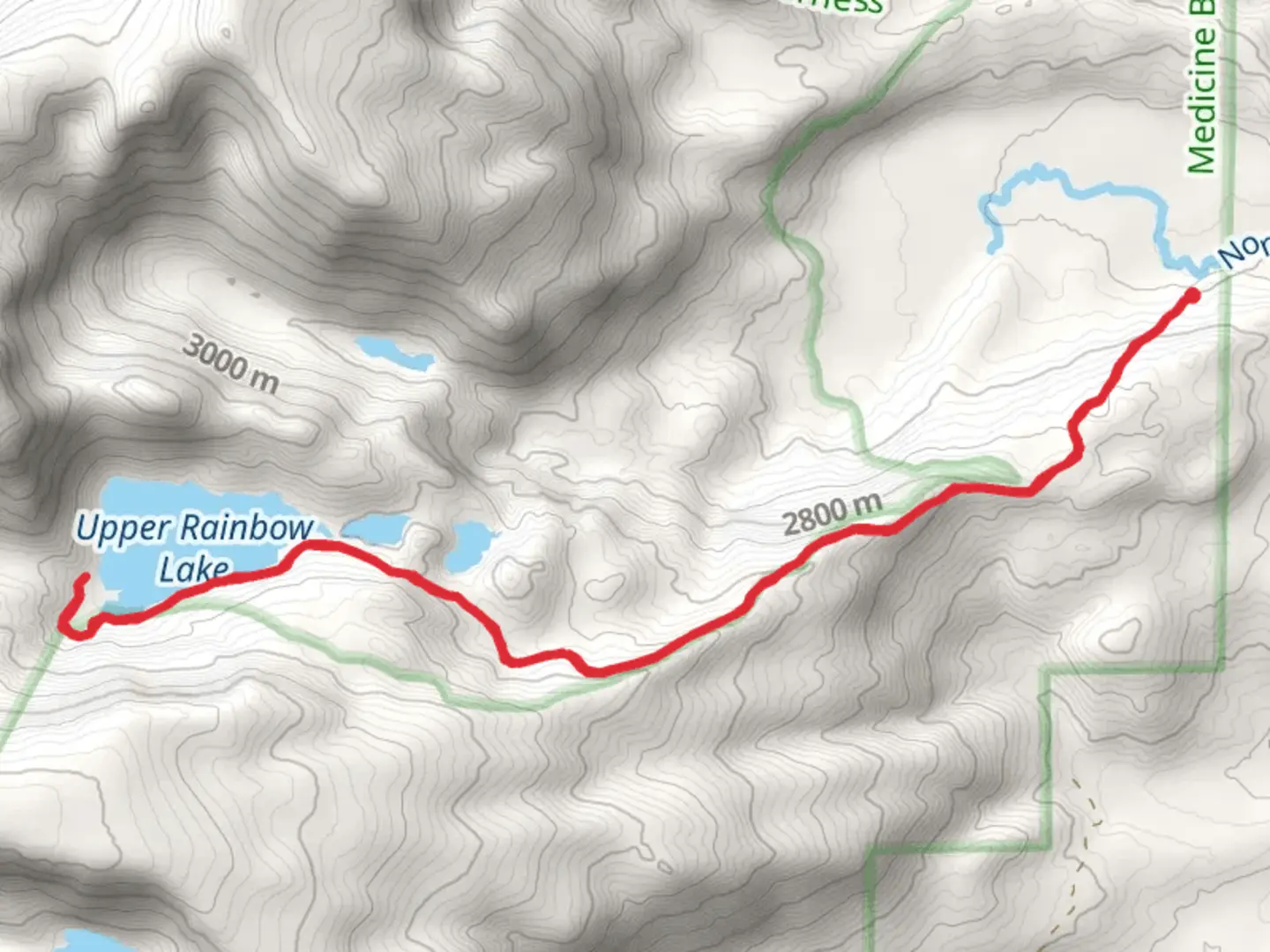 An image depicting the trail Upper Rainbow Lake and its surrounding area.