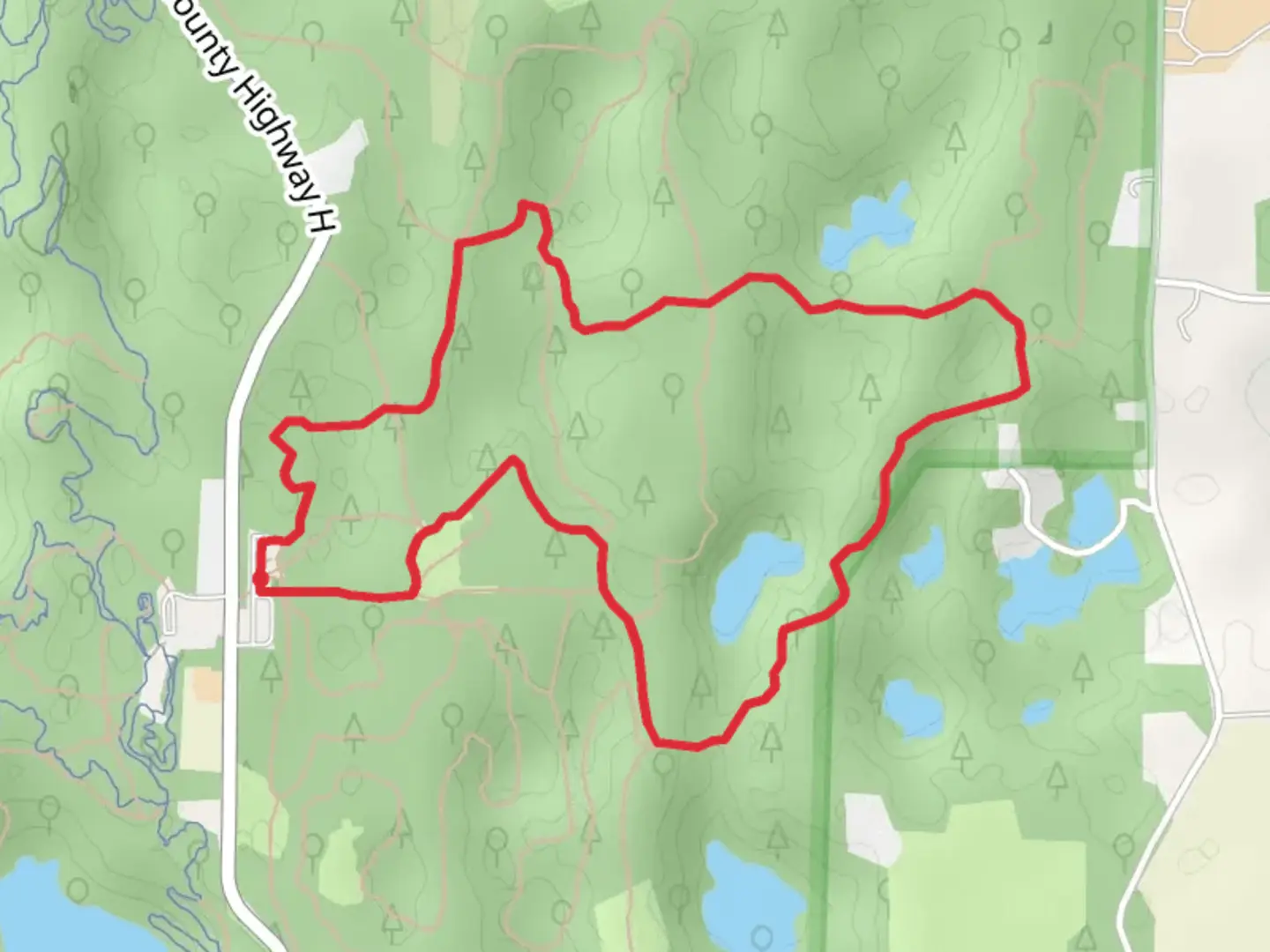 An image depicting the trail County Highway H - Blue Loop and its surrounding area.