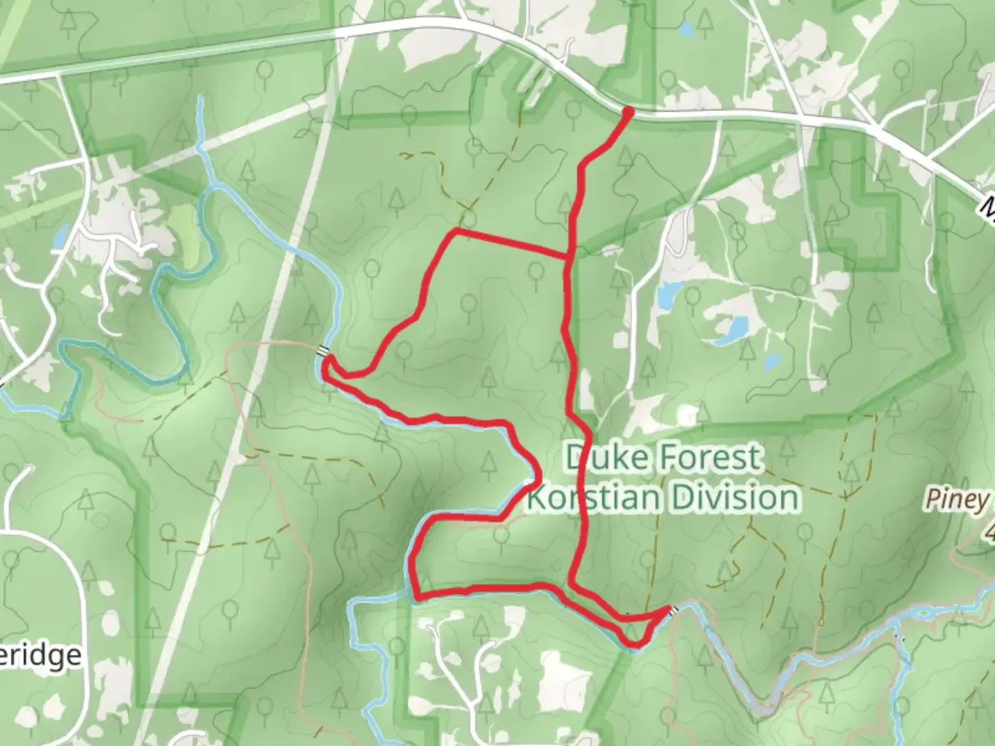 An image depicting the trail Concrete Bridge Road and New Hope Creek Trail North Loop and its surrounding area.