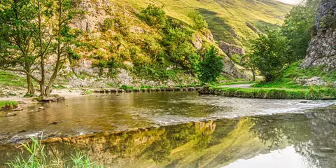 An image depicting the trail Dove Dale and Wolfscote Dale and its surrounding area.