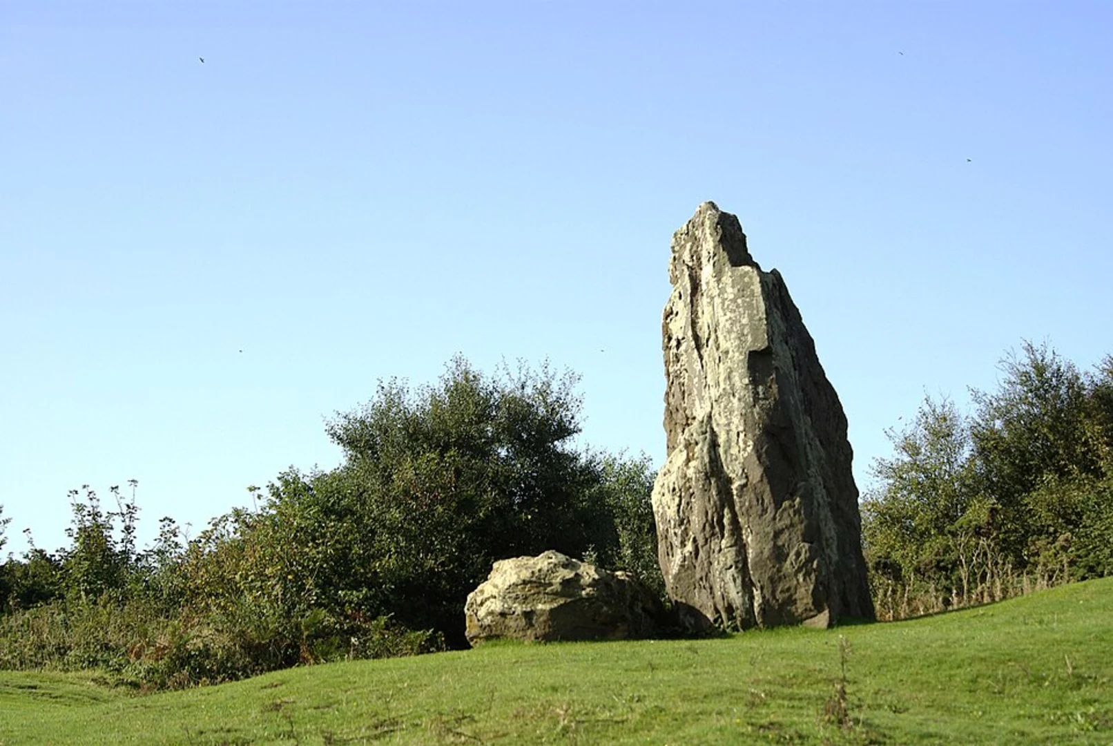An image depicting the trail Mottistone Down and The Longstone via Tennyson Trail and its surrounding area.