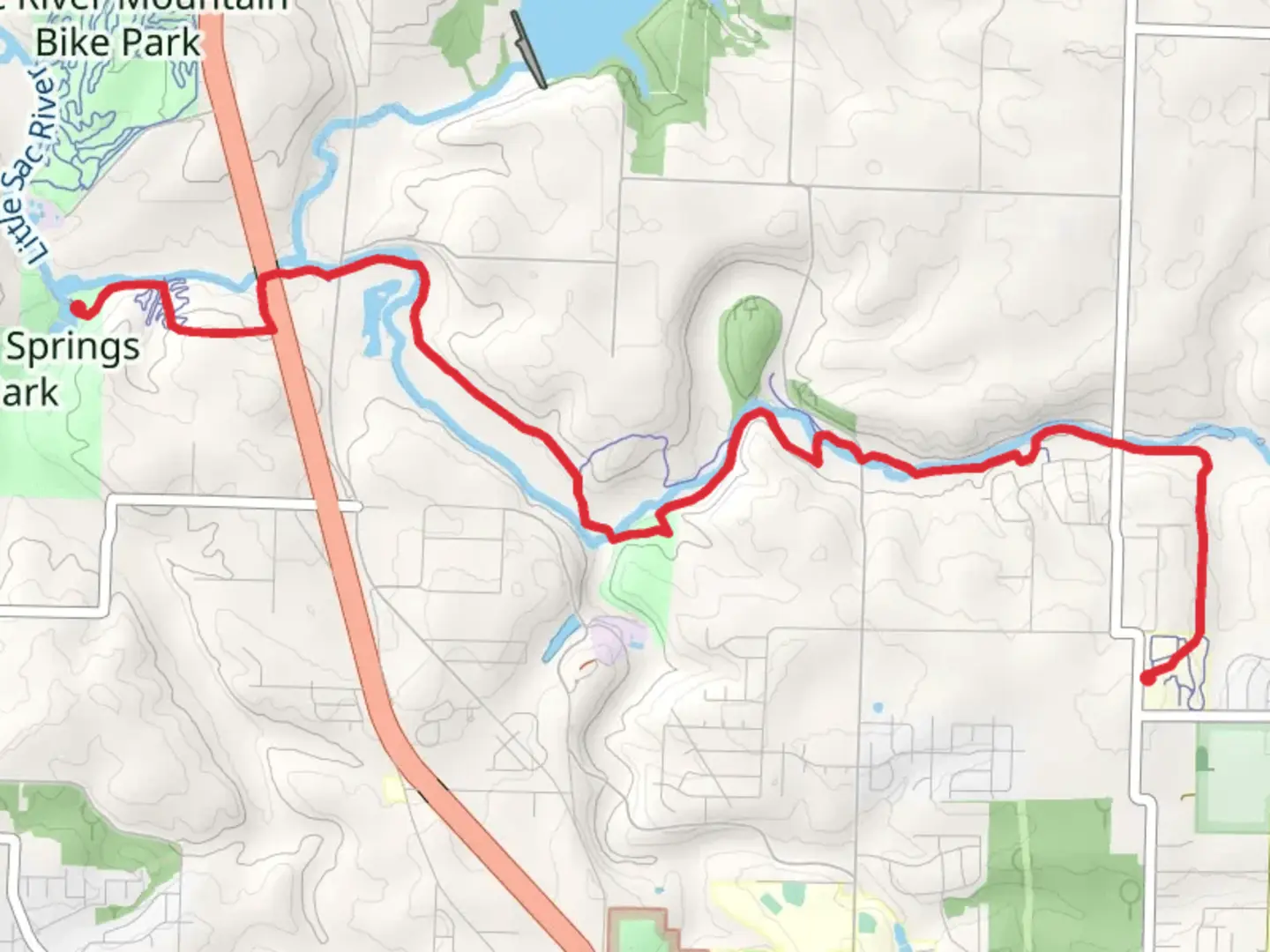 An image depicting the trail Fulbright Spring Greenway and its surrounding area.