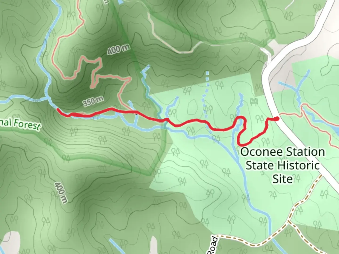An image depicting the trail Station Cove Falls and its surrounding area.