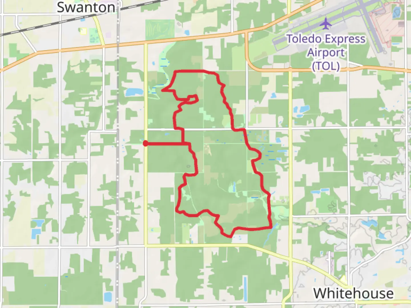 An image depicting the trail Evergreen Lake and Oak Openings Preserve Metropark Loop and its surrounding area.