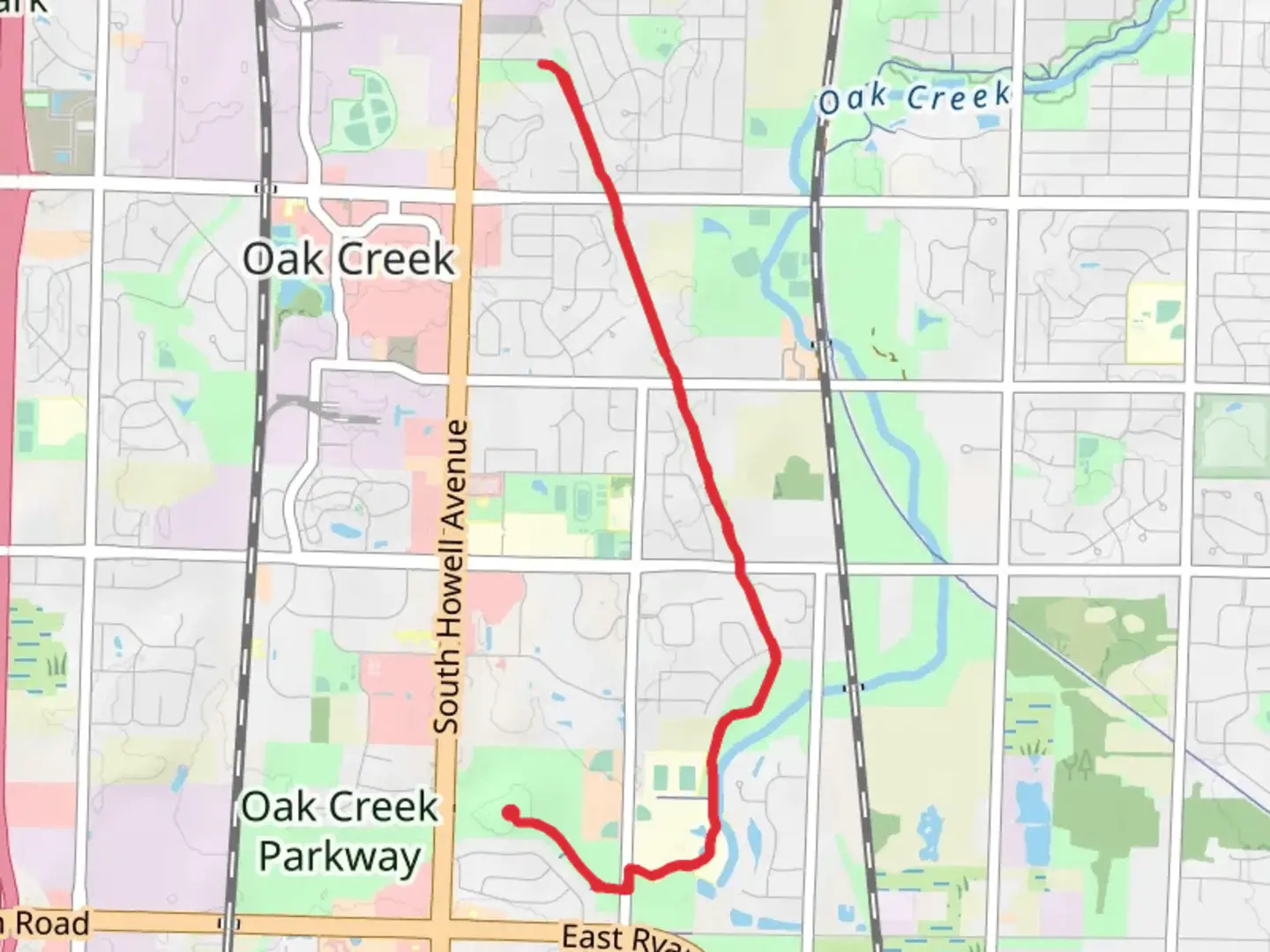 An image depicting the trail Greenlawn Park Walk and its surrounding area.