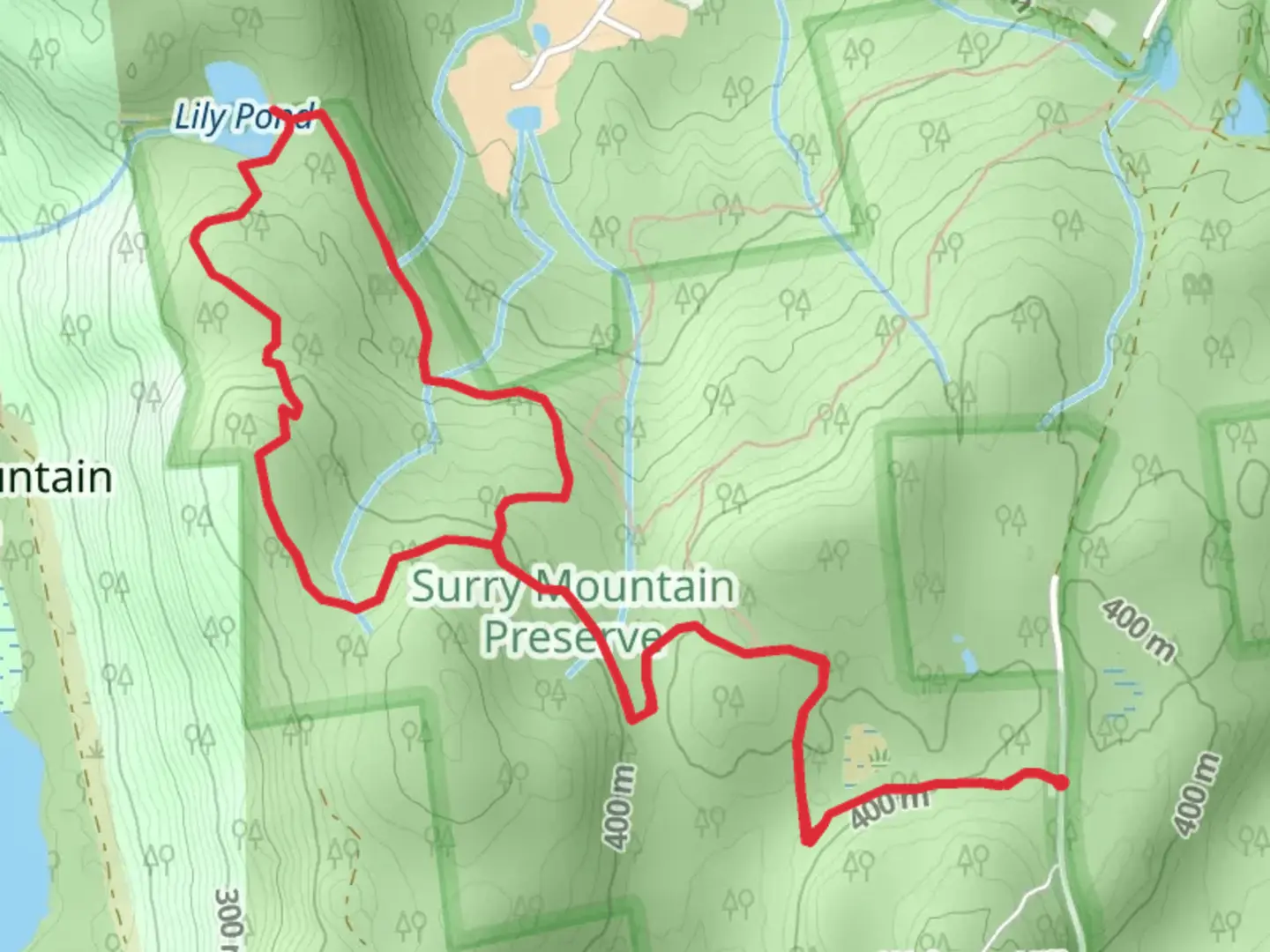 An image depicting the trail Lily Pond from Old Gilsum Road and its surrounding area.