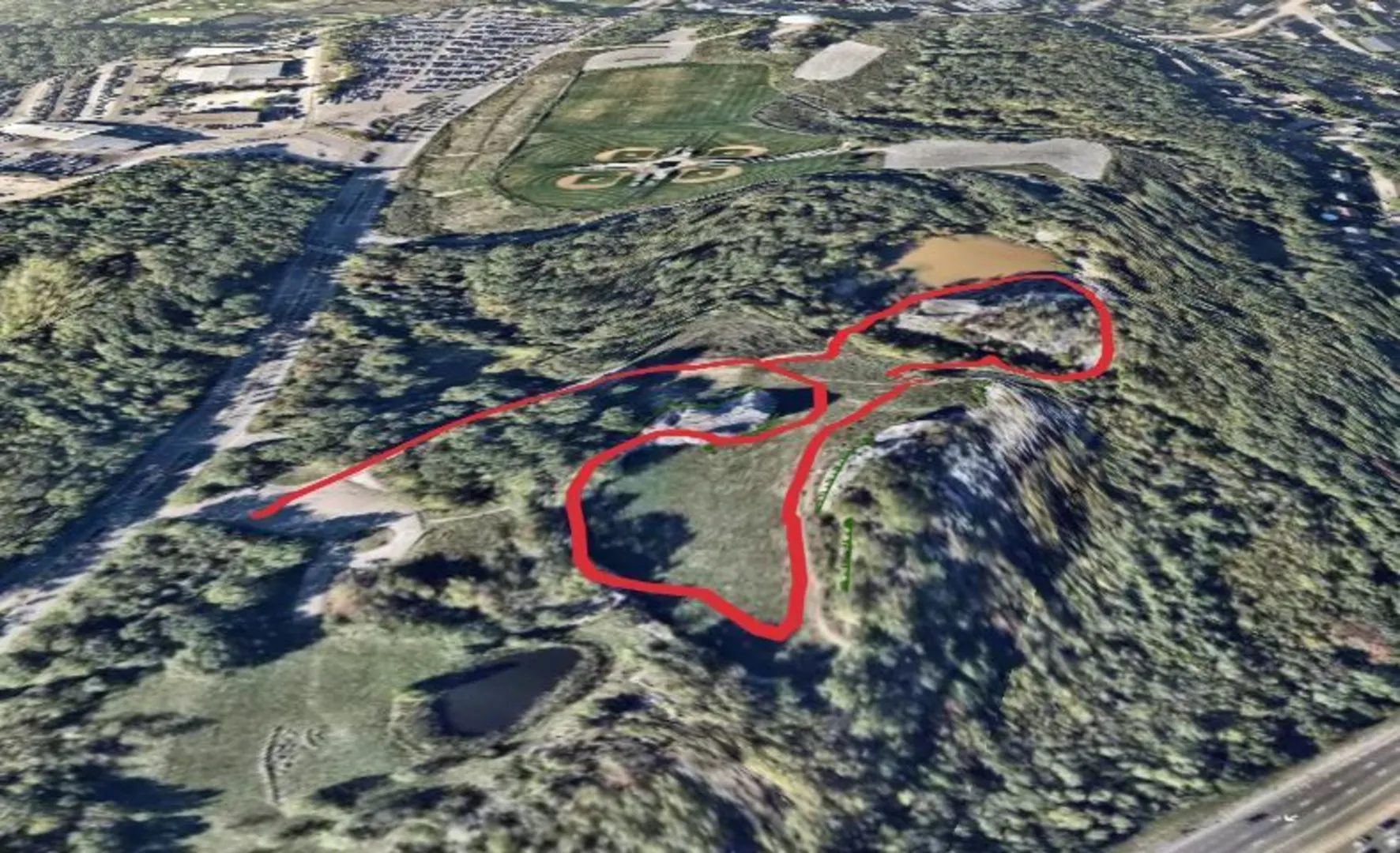An image depicting the trail Quincy Quarries Reservation Loop and its surrounding area.