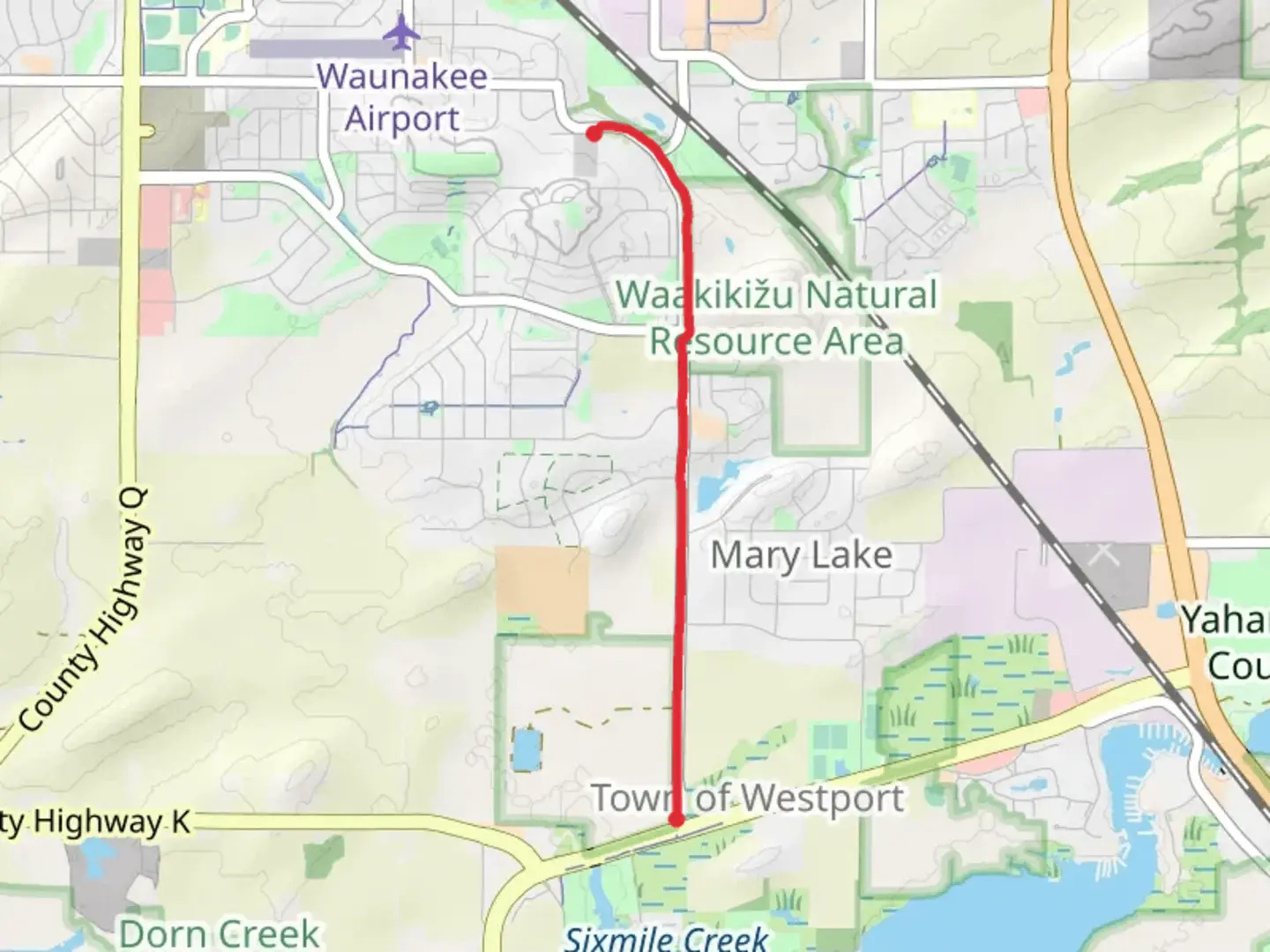 An image depicting the trail Walk beside Woodland Drive and its surrounding area.