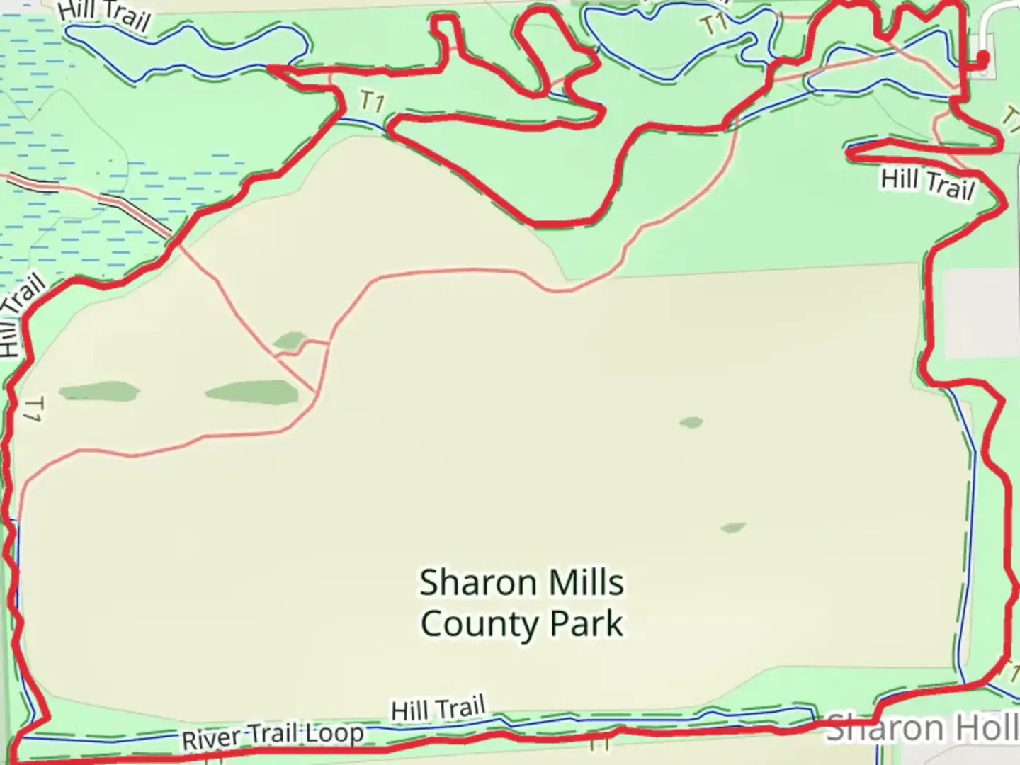 An image depicting the trail Sharon Hollow - Hill Loop Trail and its surrounding area.