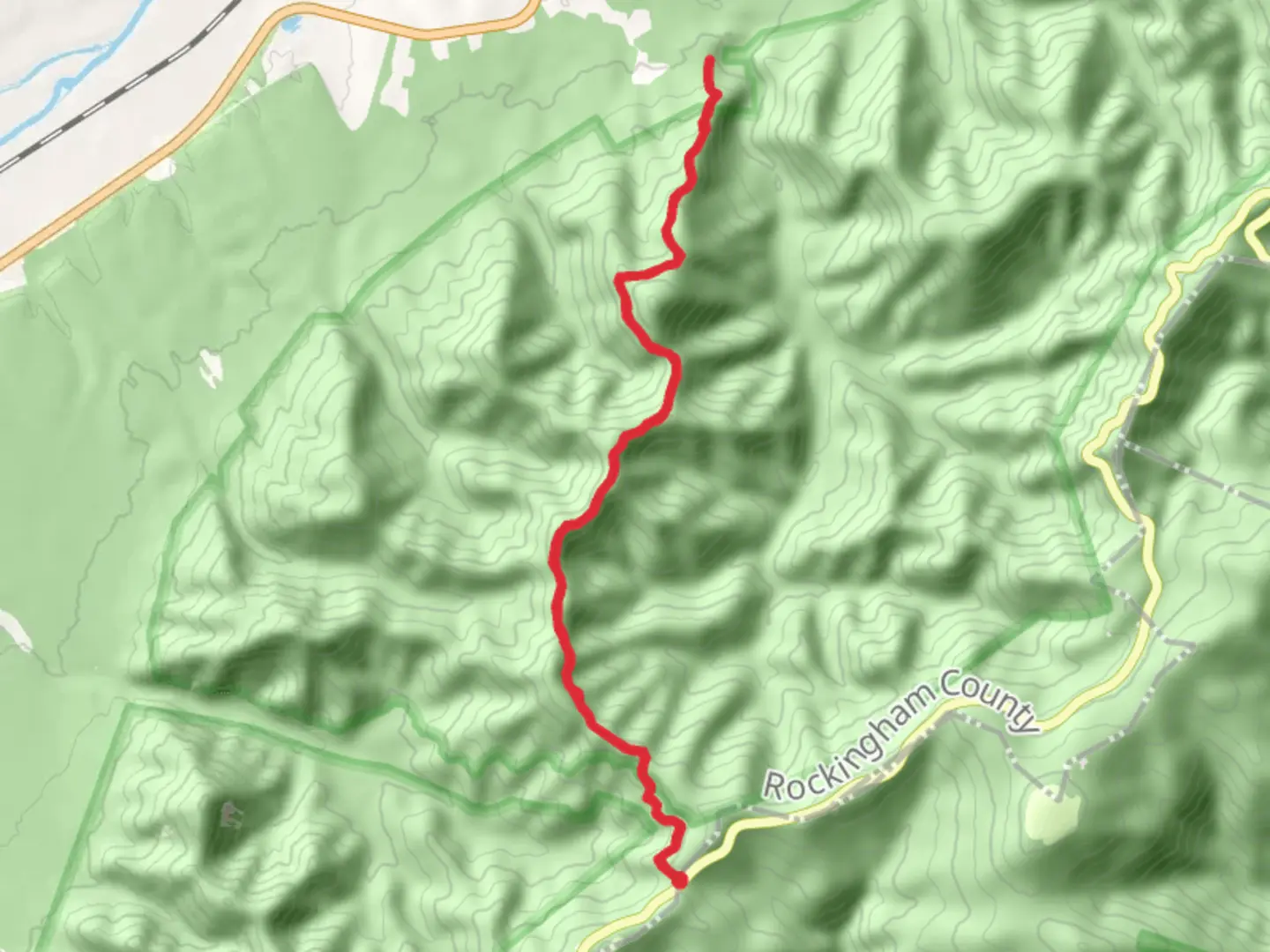 An image depicting the trail Rockytop Trail via Browns Gap Fire Road and its surrounding area.