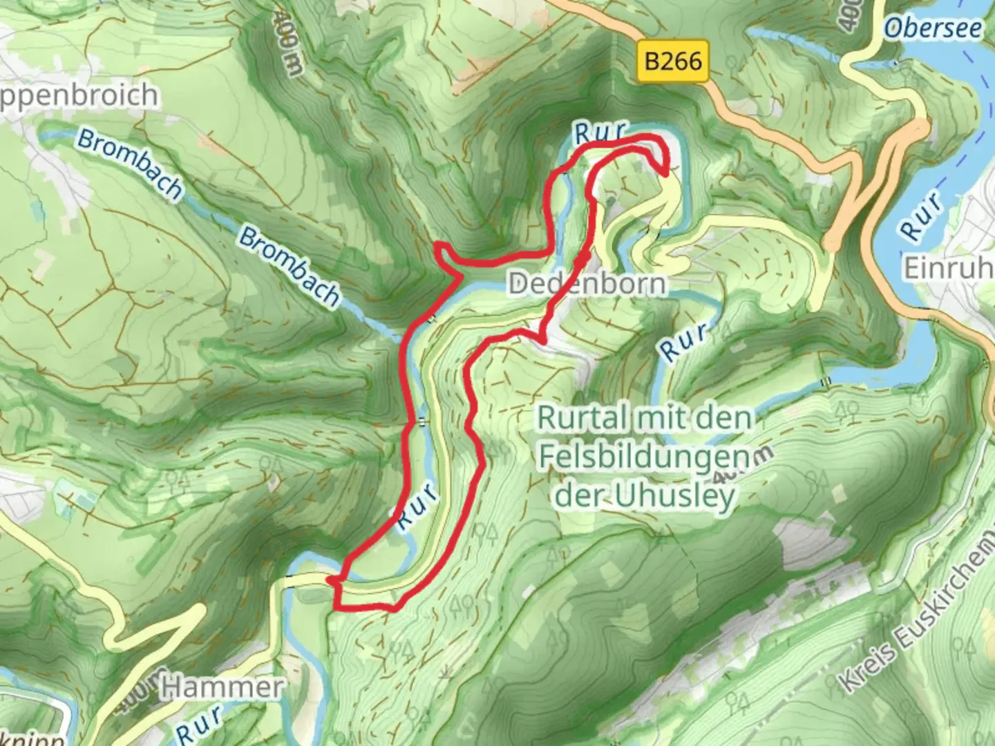 An image depicting the trail Rurtal mit den Felsbildungen der Uhusley via Eifelsteig and its surrounding area.