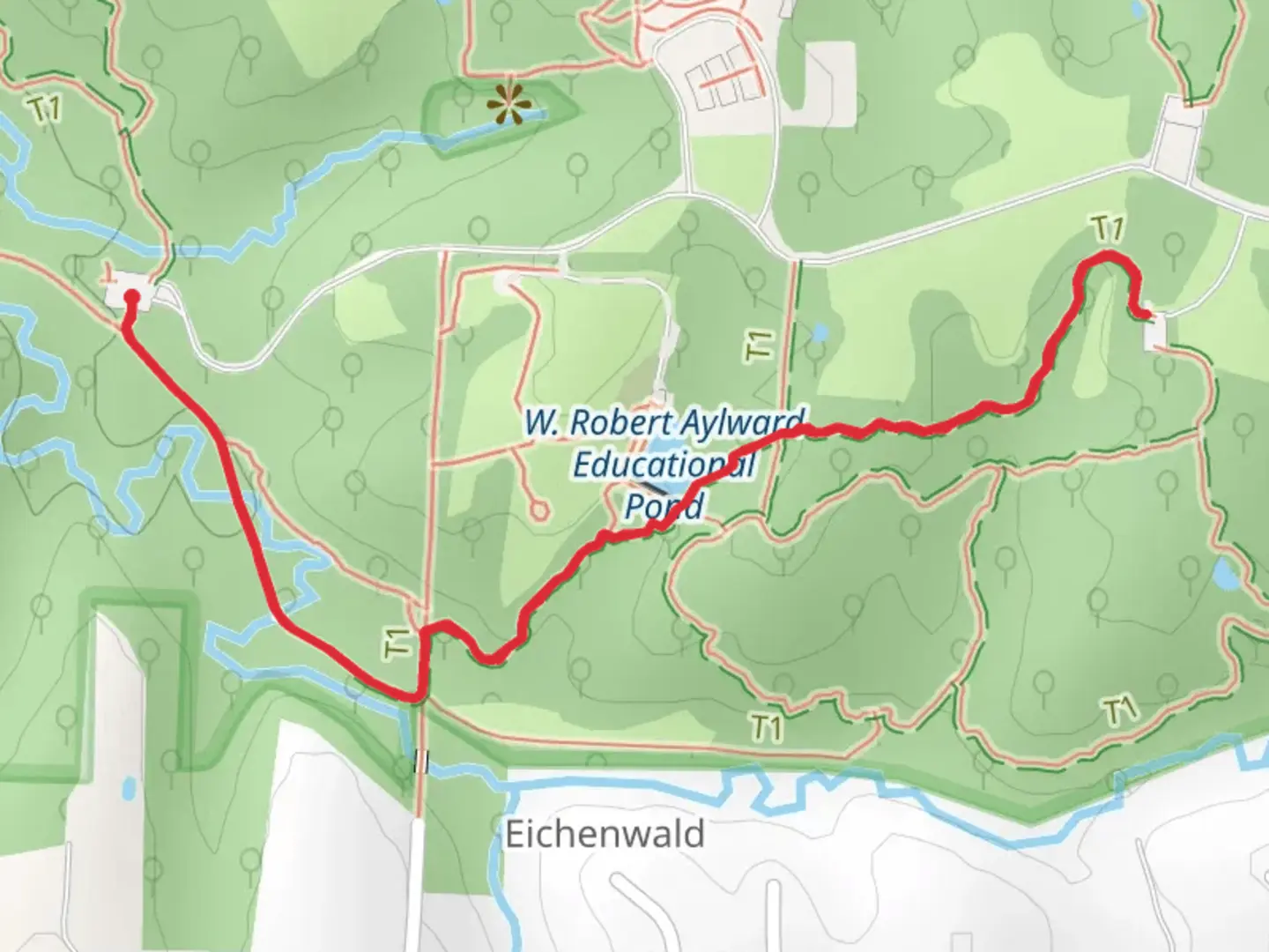 An image depicting the trail Hickory Grove Trail and its surrounding area.