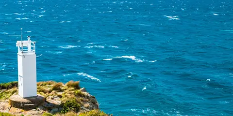 An image depicting the trail Wainui Car Park to Separation Point and its surrounding area.