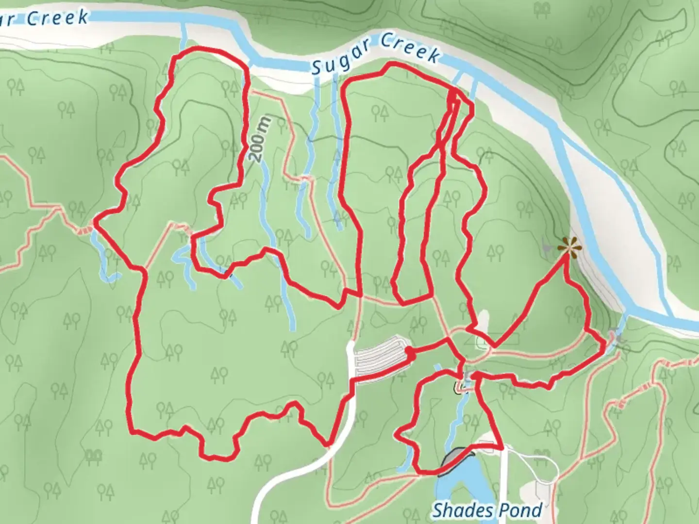 An image depicting the trail Loop beside Sugar Creek - Shades Pond and its surrounding area.