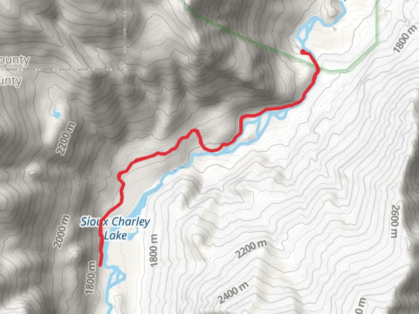 An image depicting the trail Sioux Charley Lake via Main Stillwater Trail and its surrounding area.