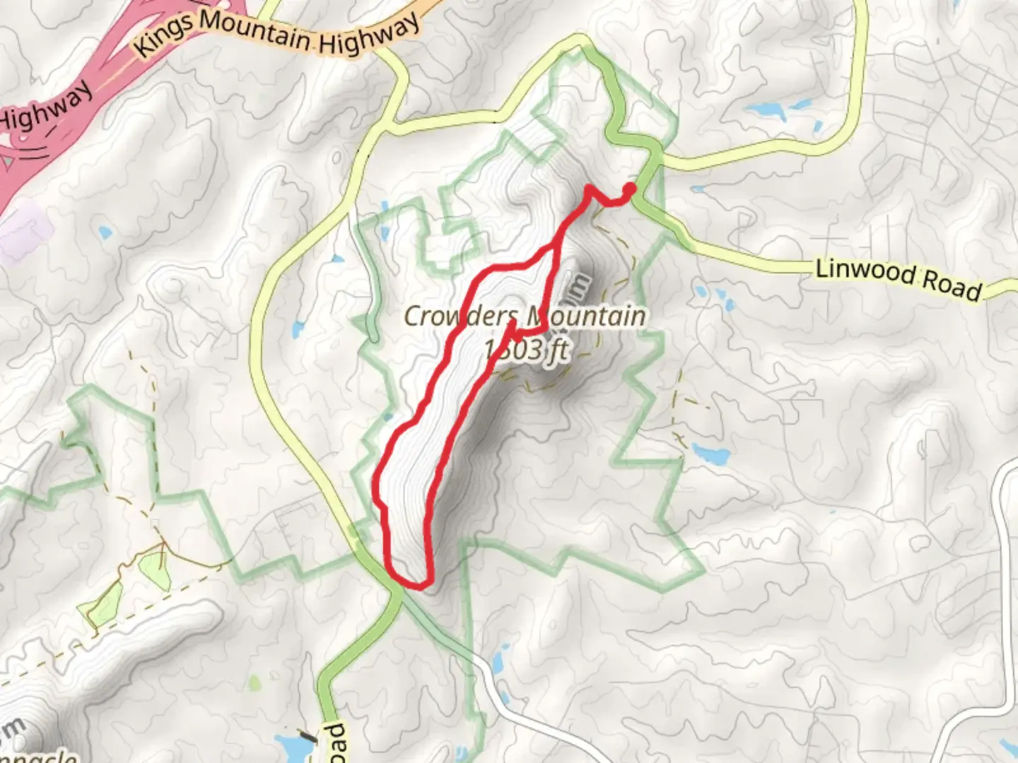 An image depicting the trail Crowders Mountain and Crowders Loop Trail and its surrounding area.